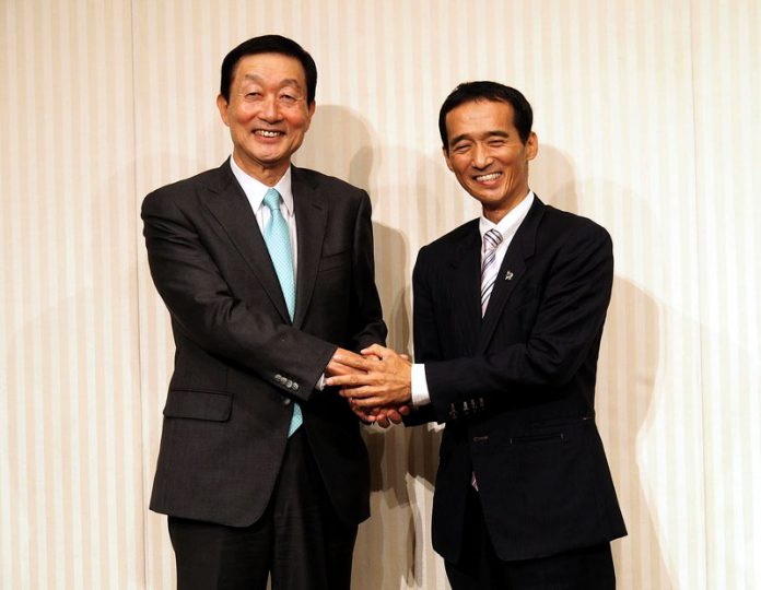 ユニーFM・高柳浩二社長㊧とドンキ・大原孝治社長