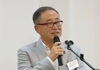 レセプションであいさつする横田和彦社長